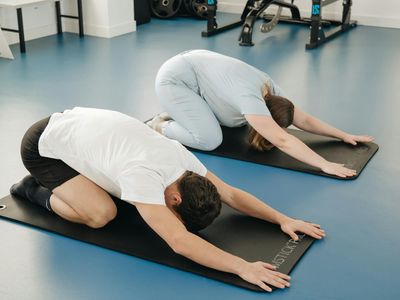 Person meditating after a workout session, calm expression.